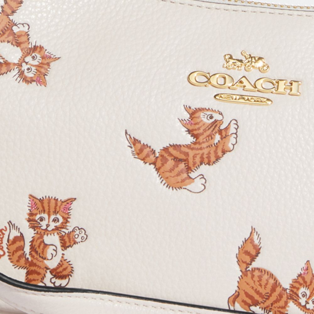 coach dancing cat purse