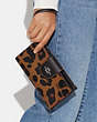 COACH®,PHONE WALLET WITH LEOPARD PRINT AND SIGNATURE CANVAS INTERIOR,Leather,Silver/Light Saddle Multi,Detail View
