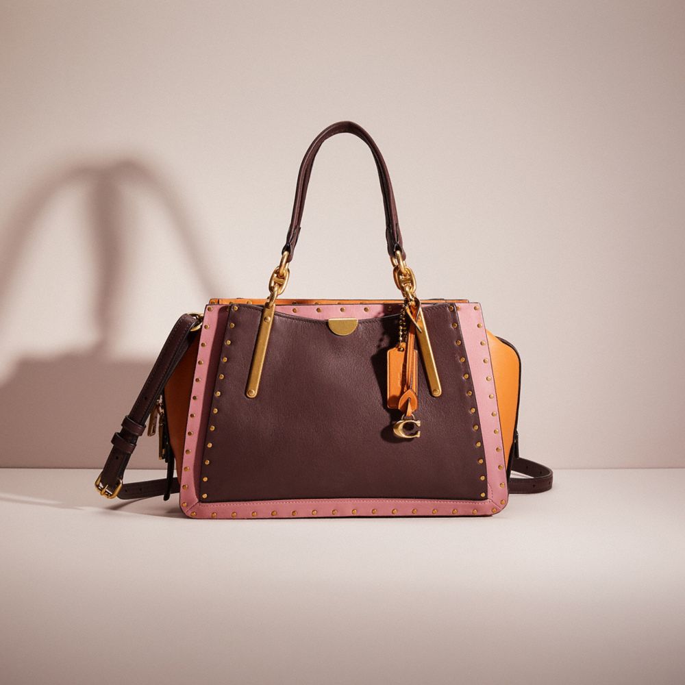 COACH®,RESTORED DREAMER WITH RIVETS,Smooth Leather,Small,Brass/Oxblood Multi,Front View