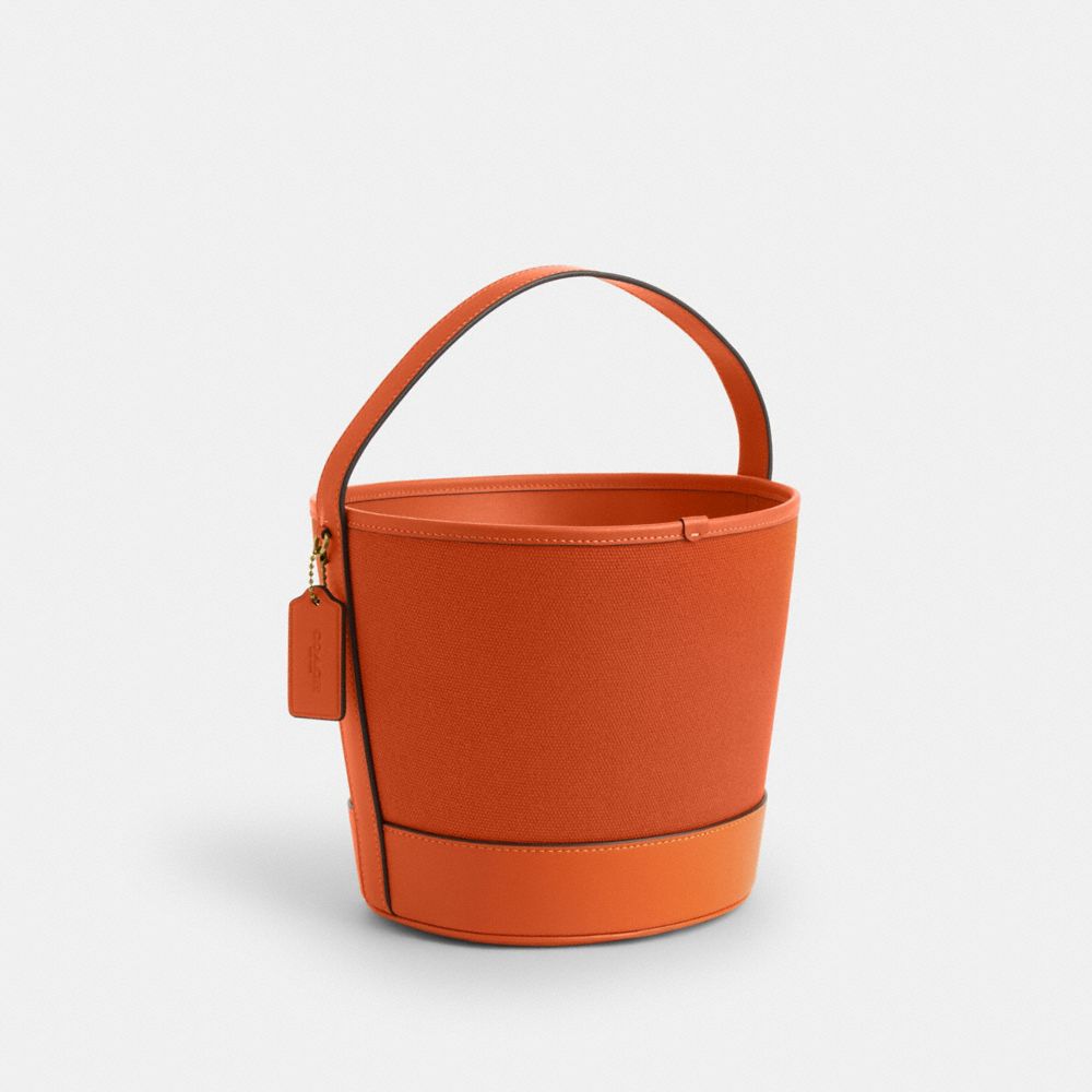 COACH®,Trick Or Treat Bucket With Halloween Pumpkin In Regenerative Cotton,Burnt Orange,Angle View