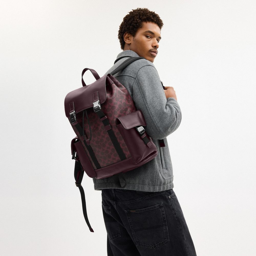COACH®,Clark Backpack In Signature Canvas,Canvas,Fabric,Leather,Calfskin Leather,Backpack,Logo,Adjustable,Suitcase Sleeve,...,Maroon,Detail View