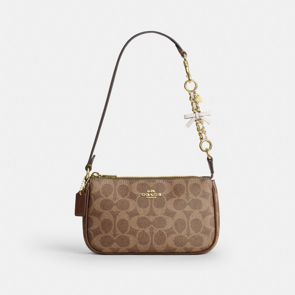 COACH®,Bow Strap Extender,Leather,Bag Accessories,Metal Material,Embellished,Bow,Logo,Compact,Gold Metal,,Angle View