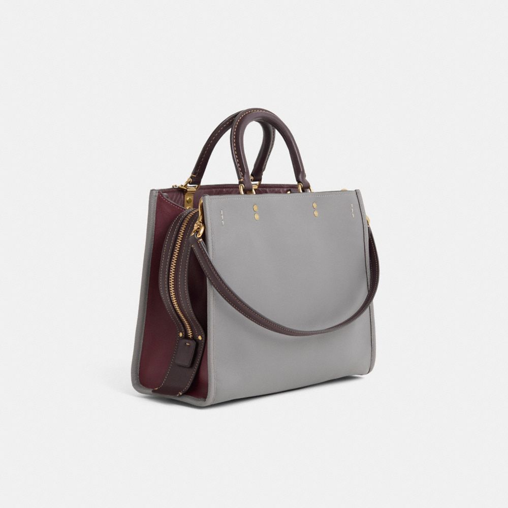 COACH®,Upcrafted Rogue Bag In Colorblock,Leather,Satchel,Perforated,Studded,Metal,Color Block,Logo,Brass,Work,Casual,Purple,Angle View