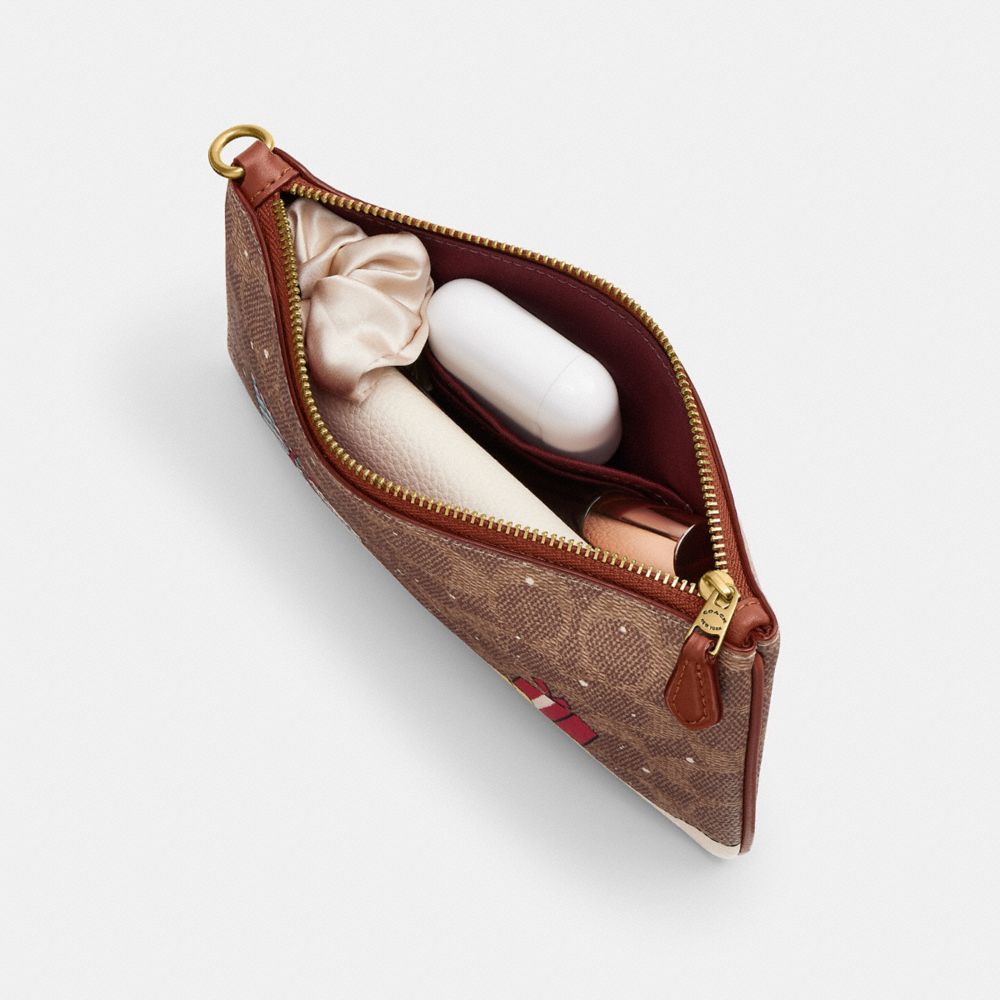 Essential Small Wristlet In Signature Canvas With Holiday Gifts