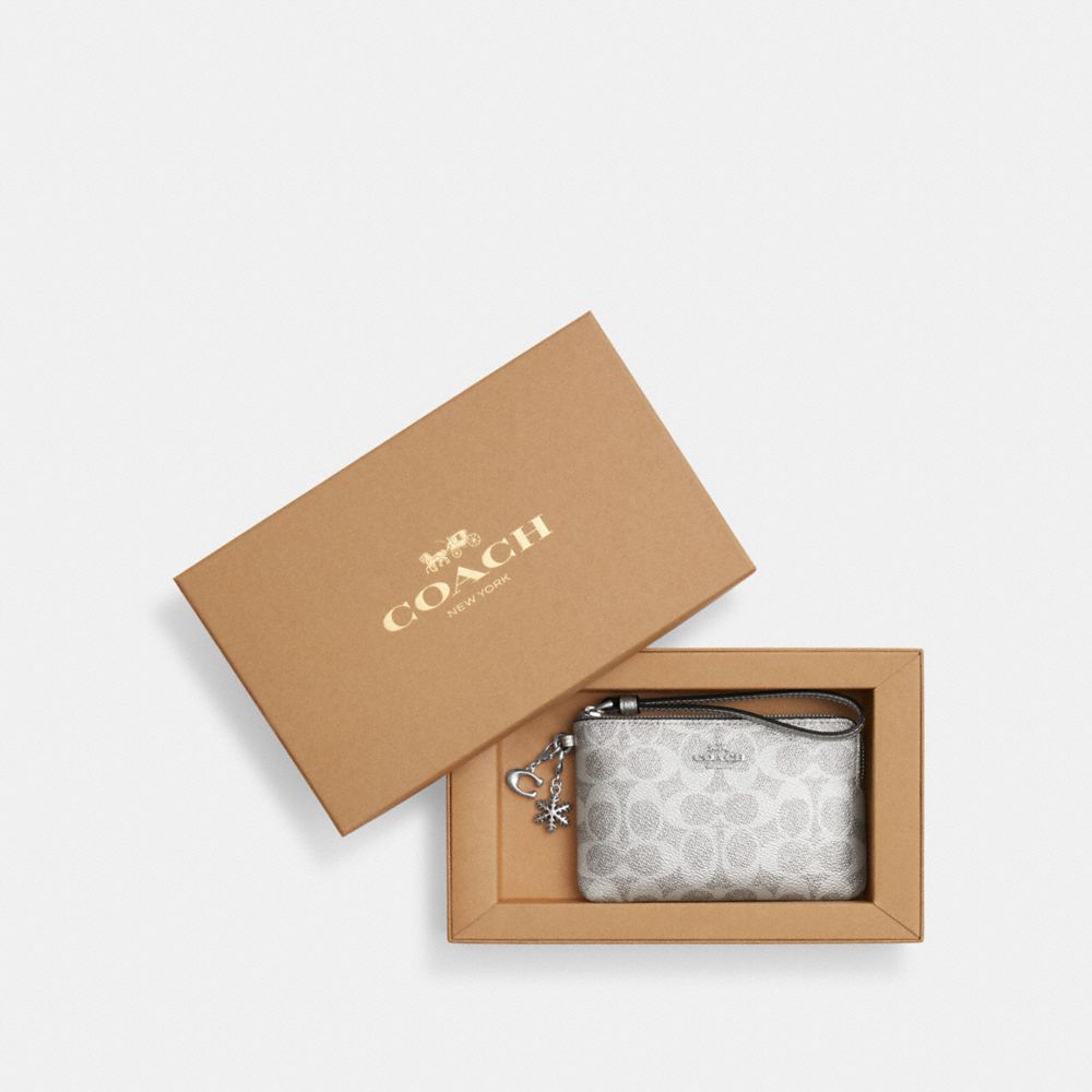 COACH®,Boxed Corner Zip Wristlet In Signature Canvas With Charms,Gray,Front View