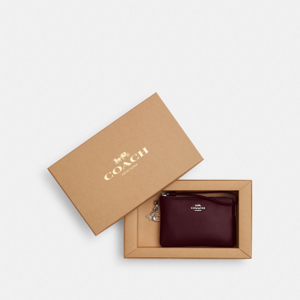 COACH®,Boxed Corner Zip Wristlet With Charms,Pouch,Wristlet,Metal,Pendant,Casual,Maroon,Front View