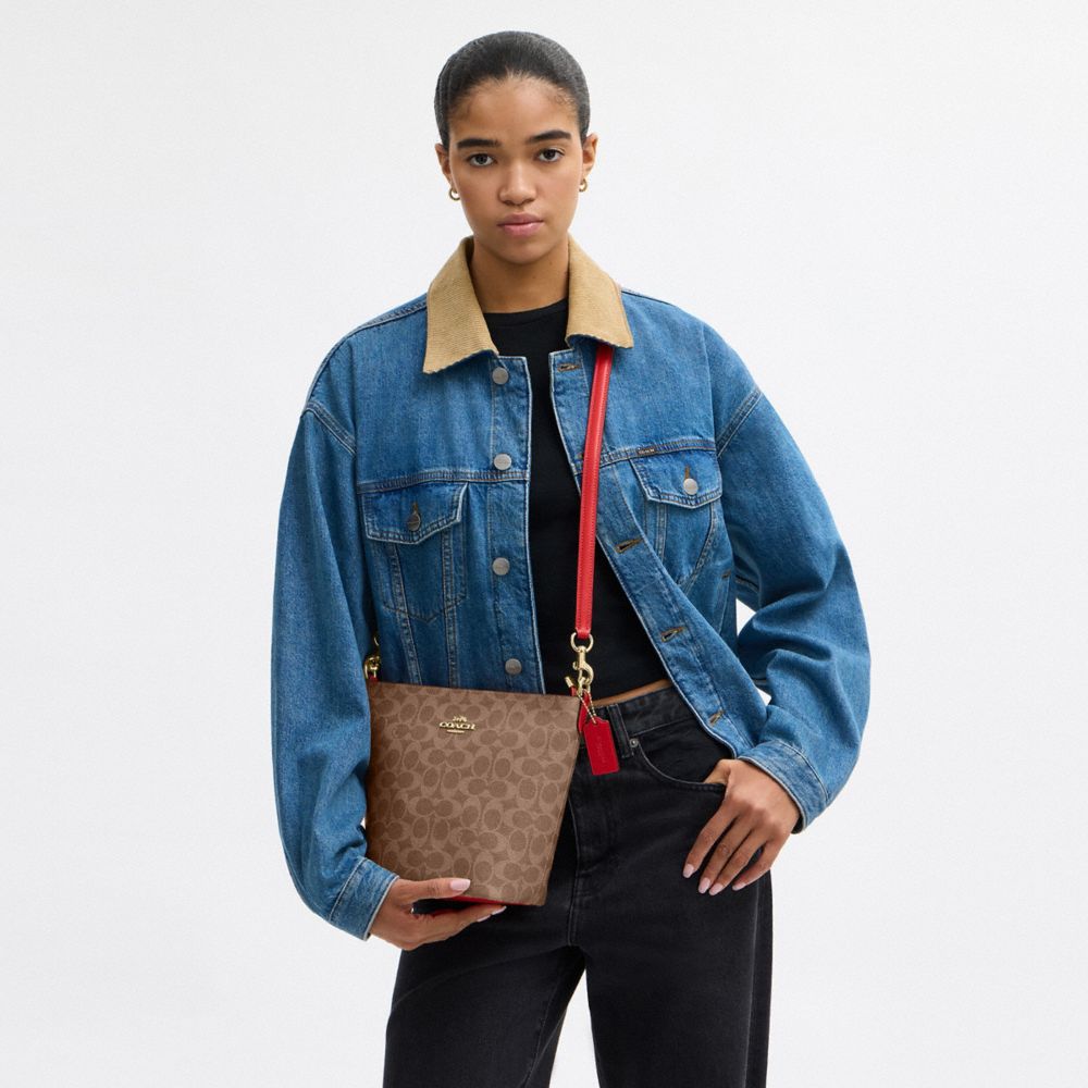 COACH®,Logan Duffle Bag In Signature Canvas,Brown