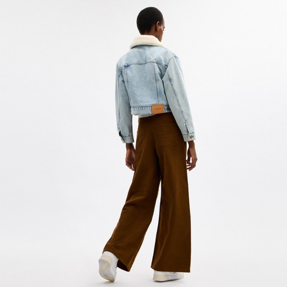 COACH®,Cropped Heritage C Denim Trucker Jacket In Organic Cotton With Shearling Collar,,Scale View