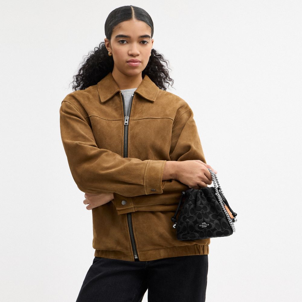 COACH®,Faye Mini Drawstring Bag In Signature Denim,Denim,Cotton,Leather,Bucket,Logo,Metal,Silver Metal,Day Party,Black,Detail View