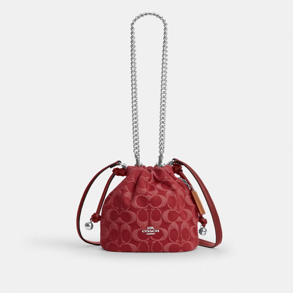 COACH®,Faye Mini Drawstring Bag In Signature Denim,Denim,Cotton,Leather,Bucket,Logo,Metal,Silver Metal,Day Party,Maroon,Front View