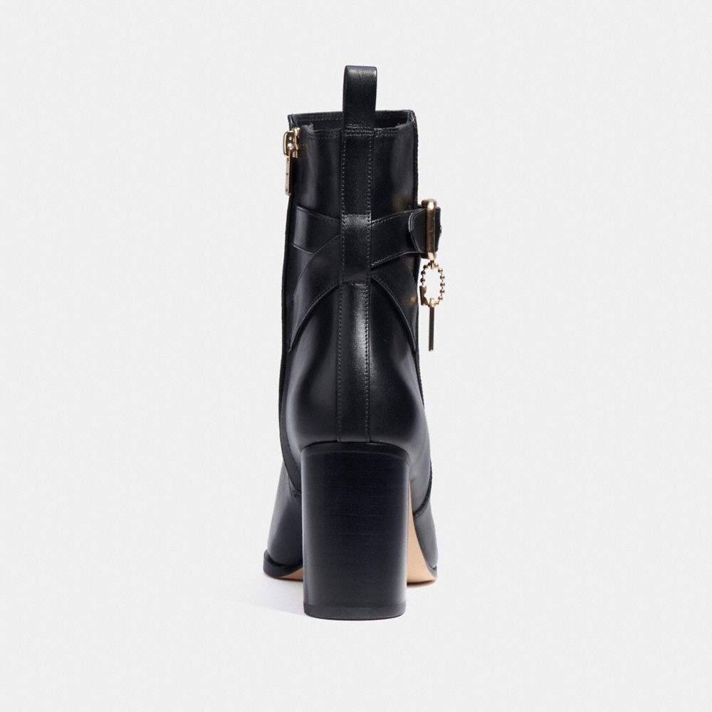 Coach delaney signature buckle sale heel bootie