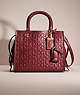 COACH®,RESTORED ROGUE 25 IN SIGNATURE LEATHER WITH FLORAL BOW PRINT INTERIOR,Smooth Leather,Medium,Brass/Bordeaux,Front View