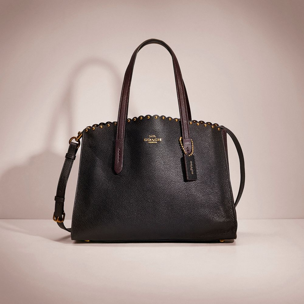 Coach charlie 2024 carryall with rivets