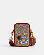 COACH®,COSMIC COACH ROGUE CROSSBODY 12 IN SIGNATURE CANVAS WITH PATCHES,Signature Coated Canvas,Mini,Tan/Rust Multi,Front View