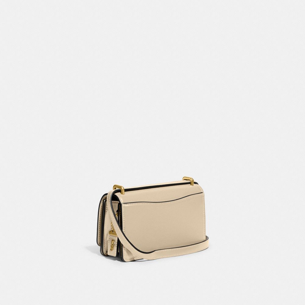 COACH®,BANDIT CROSSBODY BAG,Luxe Refined Calf Leather,Mini,Brass/Ivory,Angle View