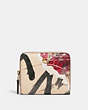 COACH®,COACH X MINT + SERF BILLFOLD WALLET,Polished Pebble Leather,Mini,Brass/Ivory Multi,Front View