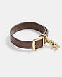 COACH®,REXY BUCKLE CHARM LEATHER BRACELET,Brass,Gold/Brown,Front View