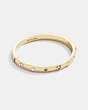 COACH®,PEGGED SIGNATURE AND STONE HINGED BANGLE,Brass,Gold/Black Diamond,Front View