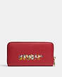 COACH®,DISNEY X COACH LONG ZIP AROUND WALLET WITH SIGNATURE CANVAS INTERIOR AND WHO IS THE FAIREST ONE OF ALL MO...,Gold/Red Apple Multi/Khaki,Back View