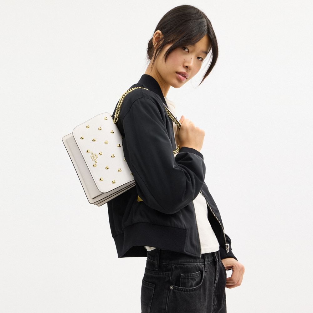 COACH®,Klare Crossbody Bag With Heart Rivets,Leather,Crossbody,Logo,Metal,Heart Embellishment,Gold Metal,Day Party,White,Detail View