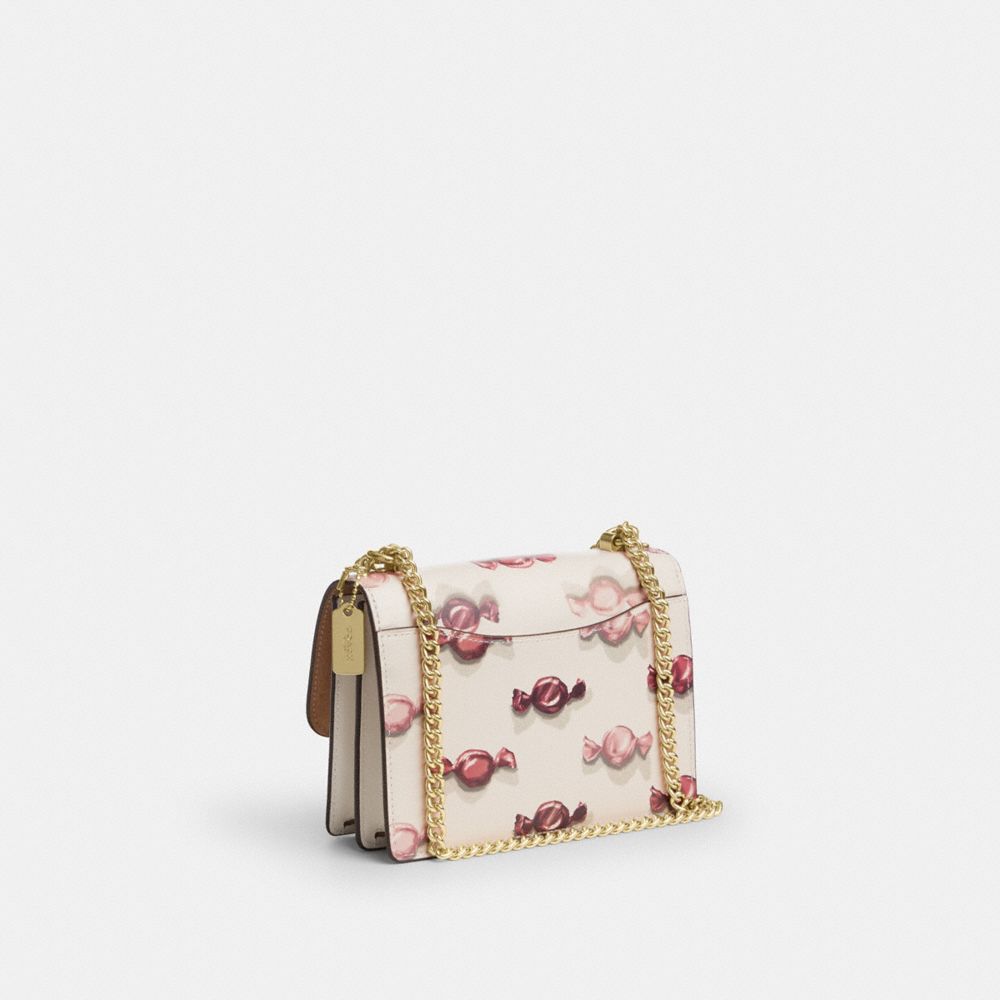 COACH®,Mini Klare Crossbody Bag With Candy Print,Calfskin Leather,Leather,Crossbody,Metal,Logo,Pendant,Day Party,Cream,Angle View