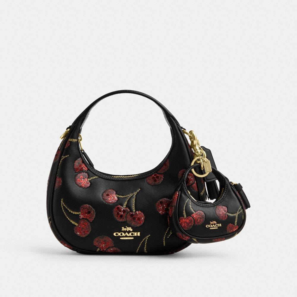 COACH®,Carmen Bag Charm With Cherry Print,,Angle View