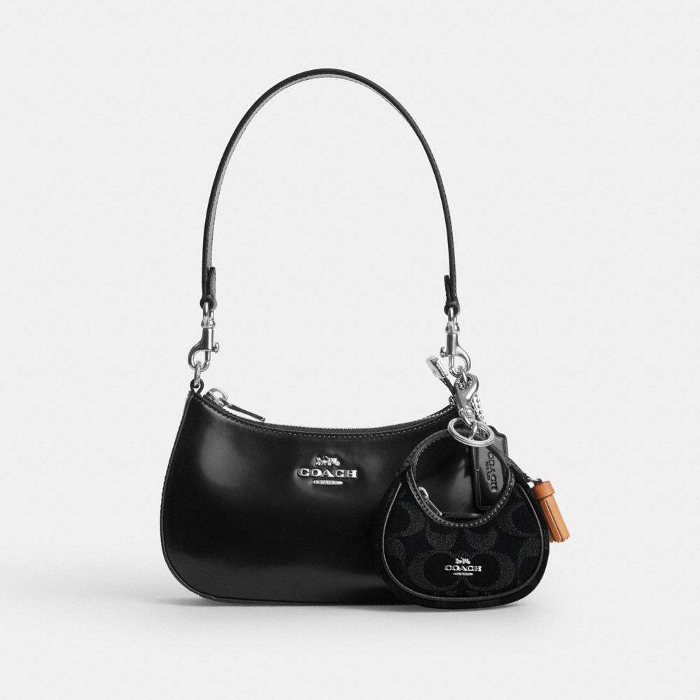 COACH®,Carmen Bag Charm In Signature Denim,,Angle View