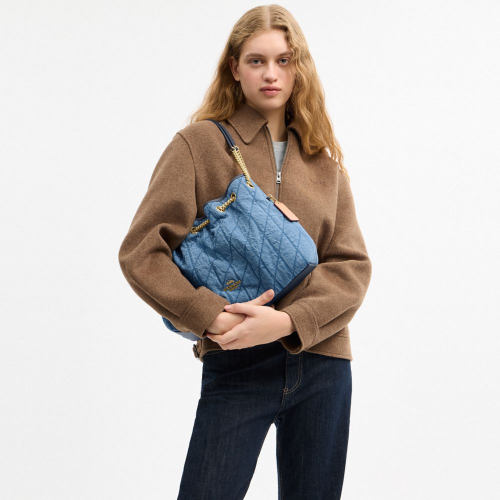 COACH®,Evelyn Shoulder Bag In Regenerative Cotton With Quilting,Leather,Denim,Cotton,Bucket,Logo,Metal,Piping,Casual,Blue,Detail View
