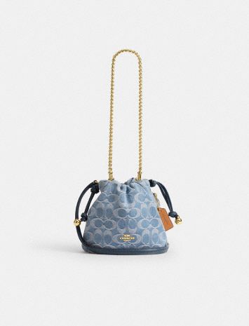 Faye Mini Drawstring Bag In Signature Denim
