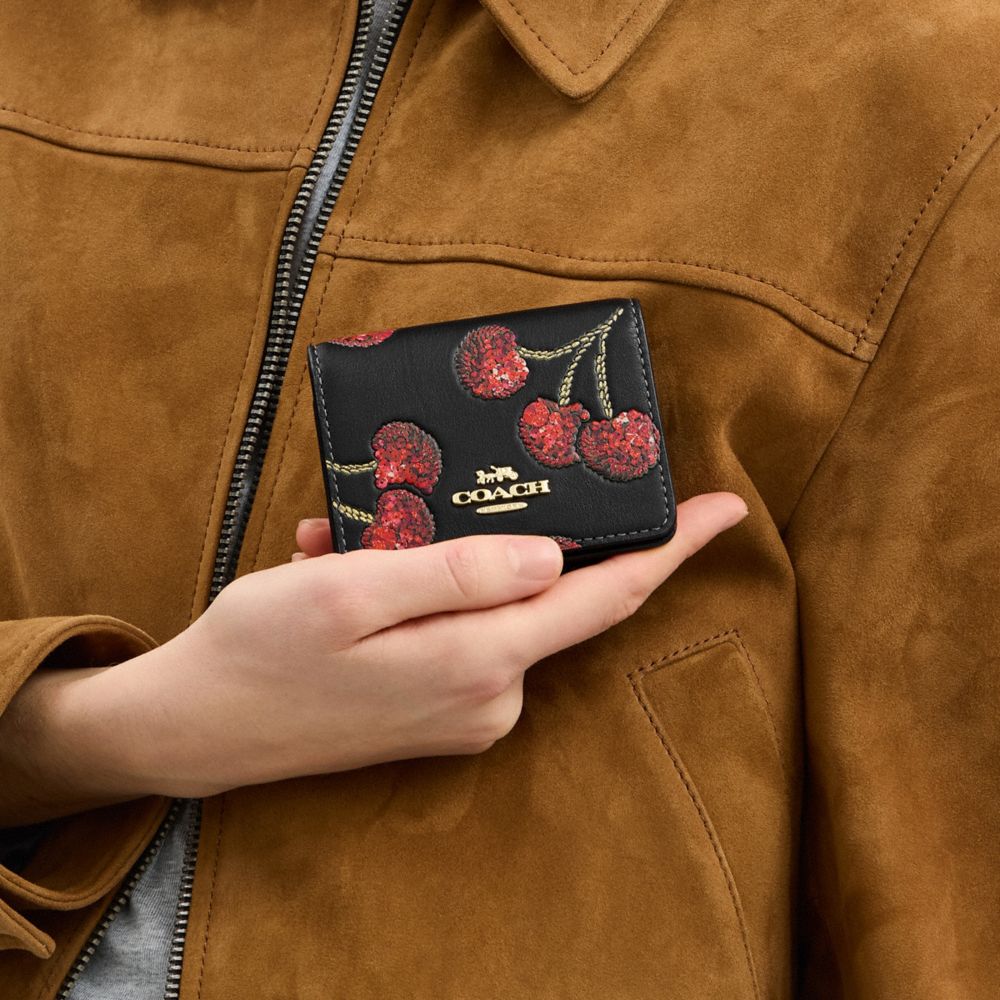 COACH®,Mini Wallet On A Chain With Cherry Print,Leather,Crossbody,Logo,Glitter,Metal,Day Party,Black,Detail View