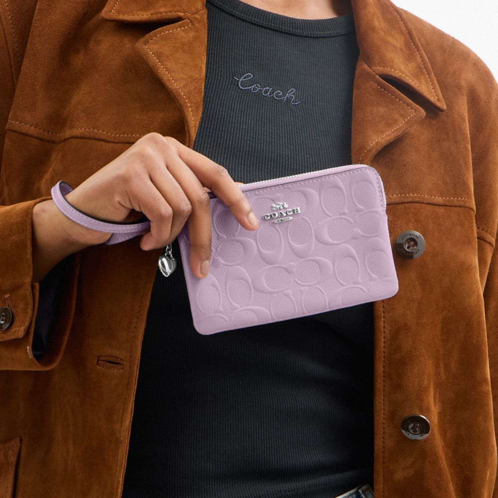 COACH®,Corner Zip Wristlet In Signature Leather With Heart Charm,Leather,Pouch,Wristlet,Embossed,Metal,Logo,Heart Embellis...,Lavender,Detail View