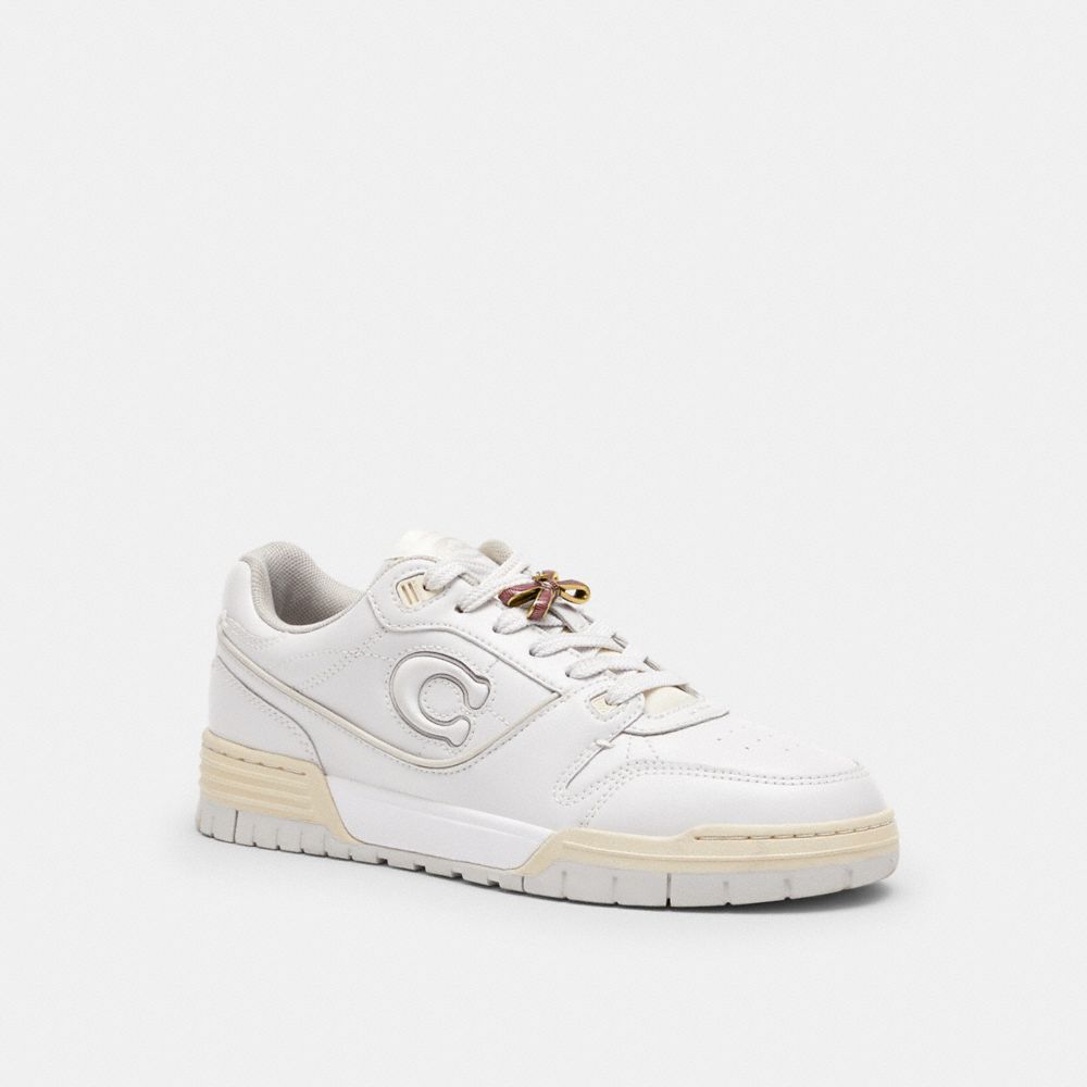 COACH®,Bow Shoelace Charm,Shoe Accessory,Bow,Pull Tab,Gunmetal,Purple,Angle View