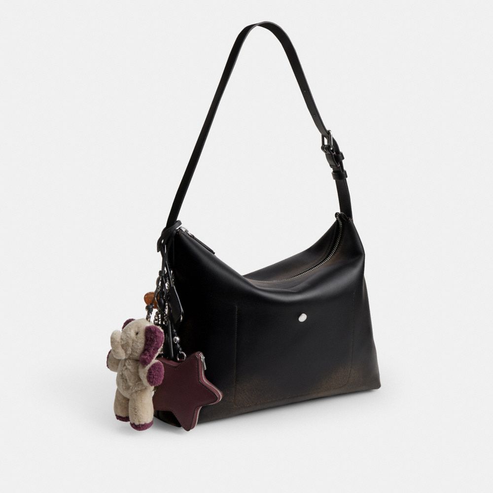 COACH®,Mott Messenger Bag 38 In Loved Leather With Charms,,Angle View