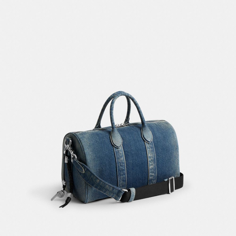 COACH®,Compass Bag 35 In Regenerative Cotton Denim With Charms,,Angle View