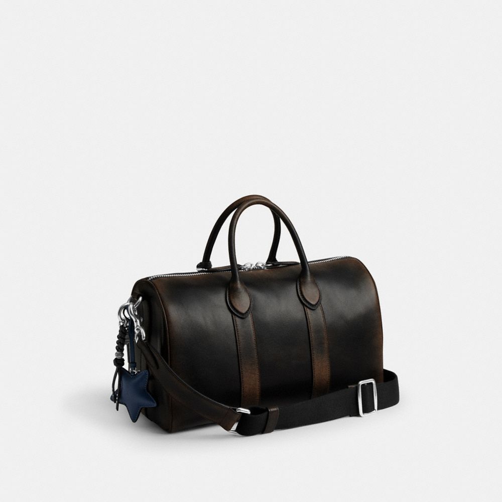 COACH®,Compass Bag 35 In Loved Leather With Charms,,Angle View