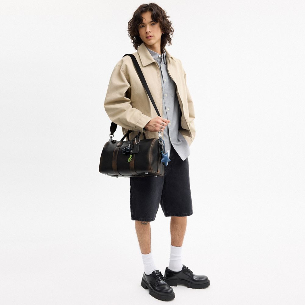 COACH®,Compass Bag 35 In Loved Leather With Charms,Black,Detail View