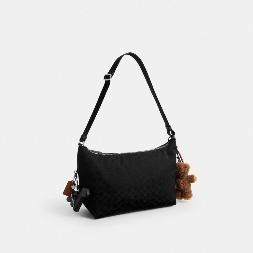 COACH®,Leo Crossbody In Signature Nylon With Charms,,Angle View