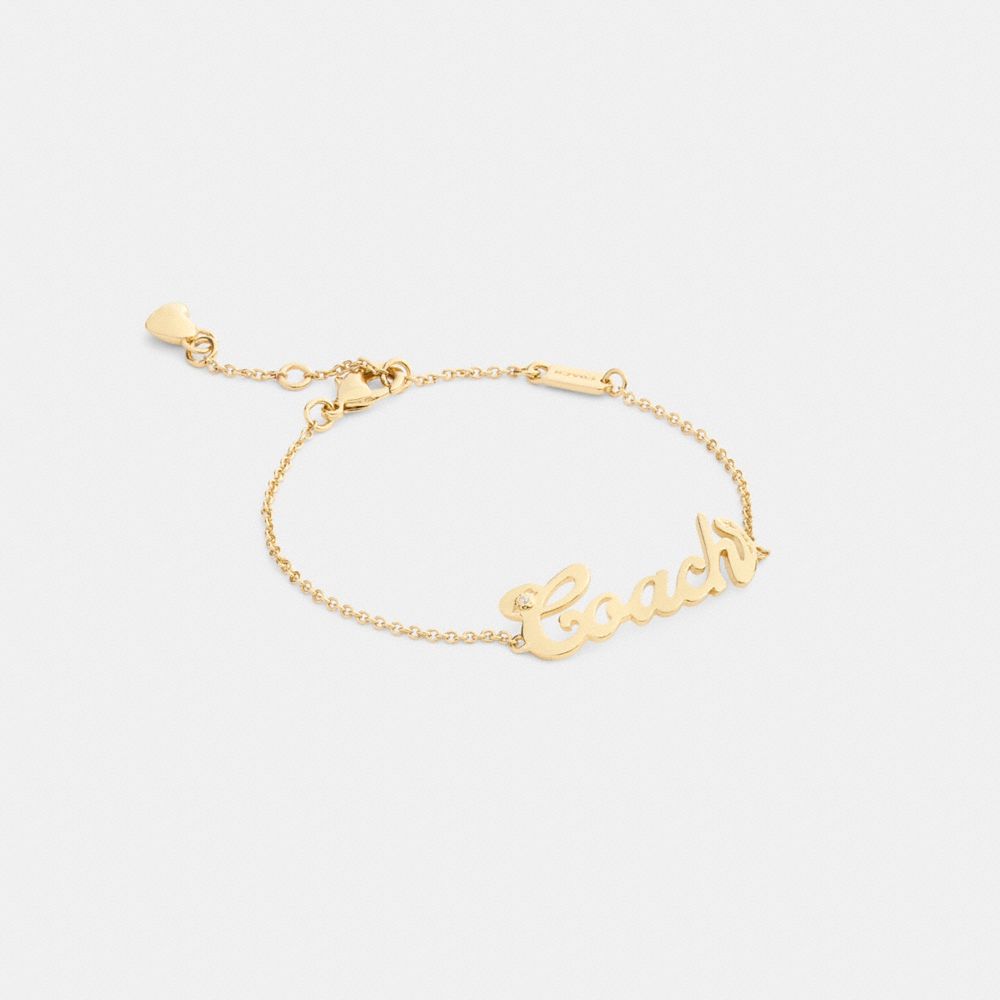 Coach Script Nameplate Bracelet In Gold