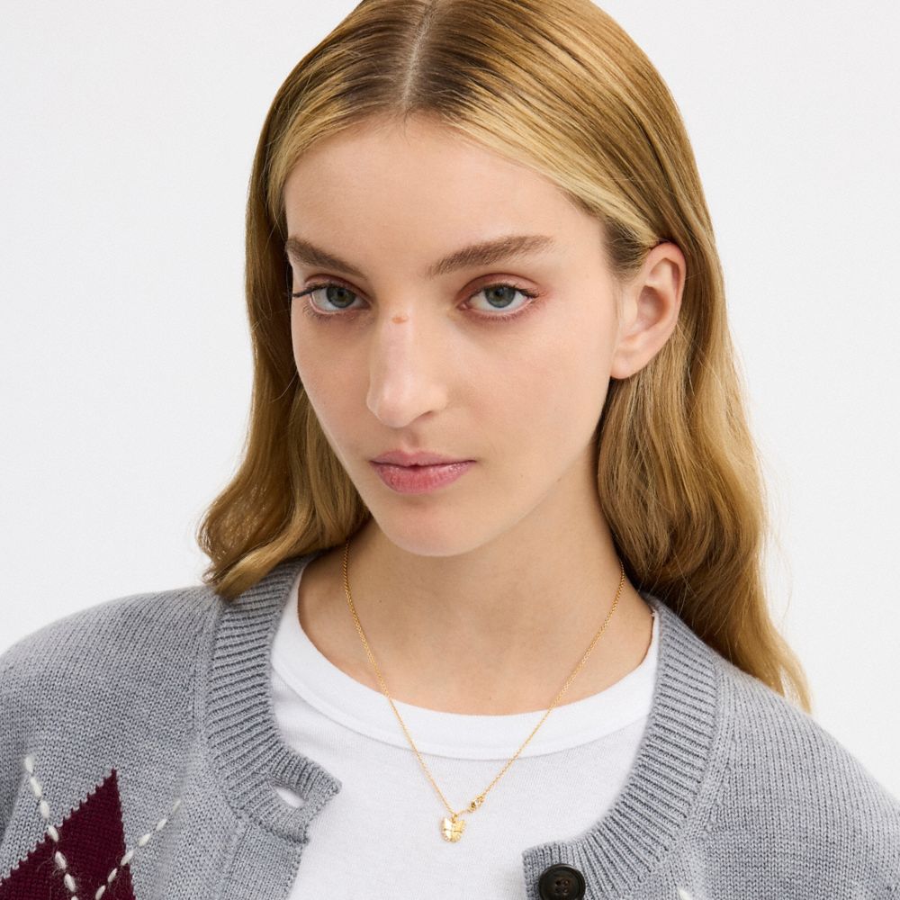 COACH®,Butterfly Pendant Necklace,Single Strand,Cubic Zirconia,Glass,Gem Embellishment,Novelty Embellishment,Logo,Letterin...,Gold,Detail View