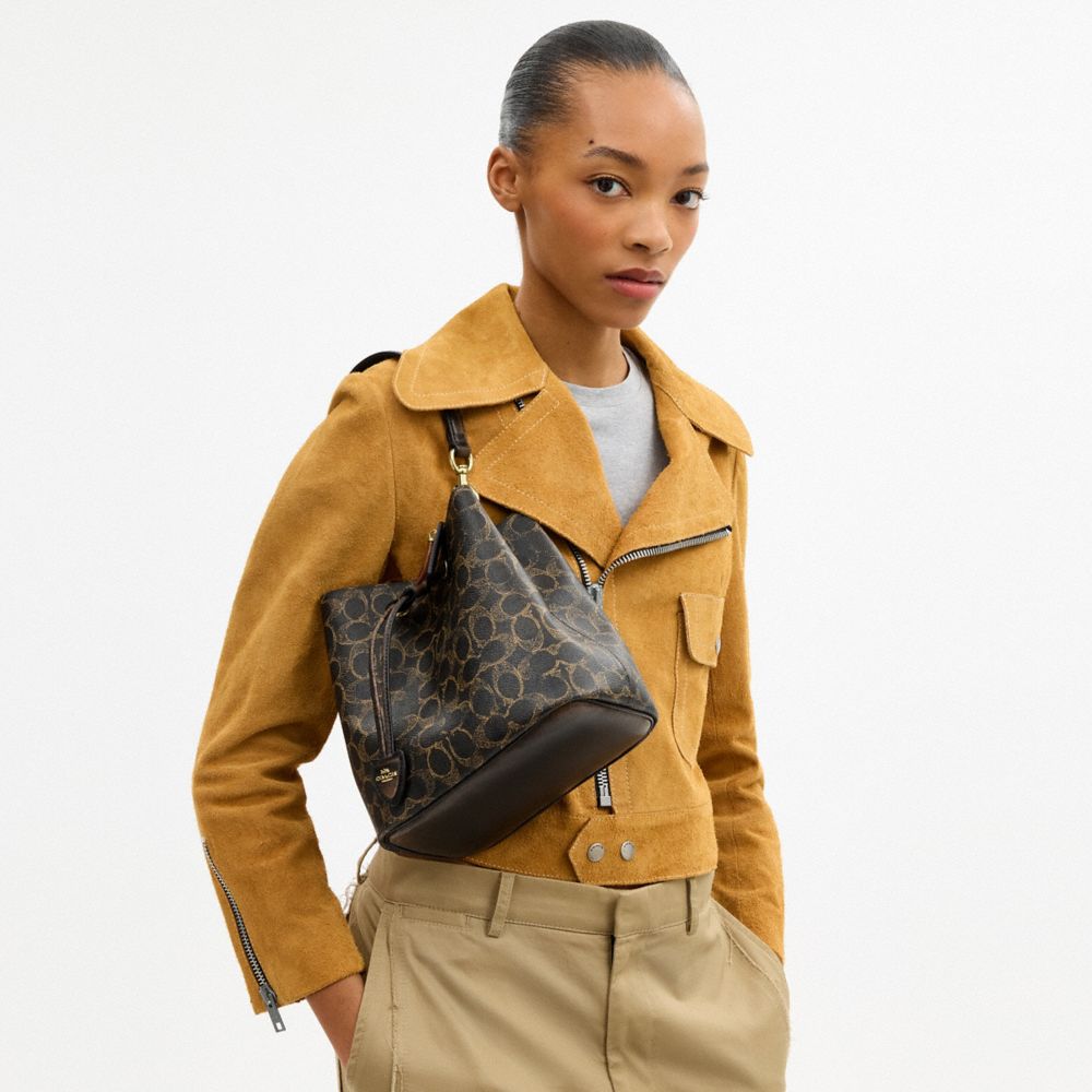 COACH®,Rowan Bucket Bag In Loved Signature Canvas With Charms,Recycled Polyester,Canvas,Leather,Bucket,Logo,Gold Metal,Gol...,Black,Detail View