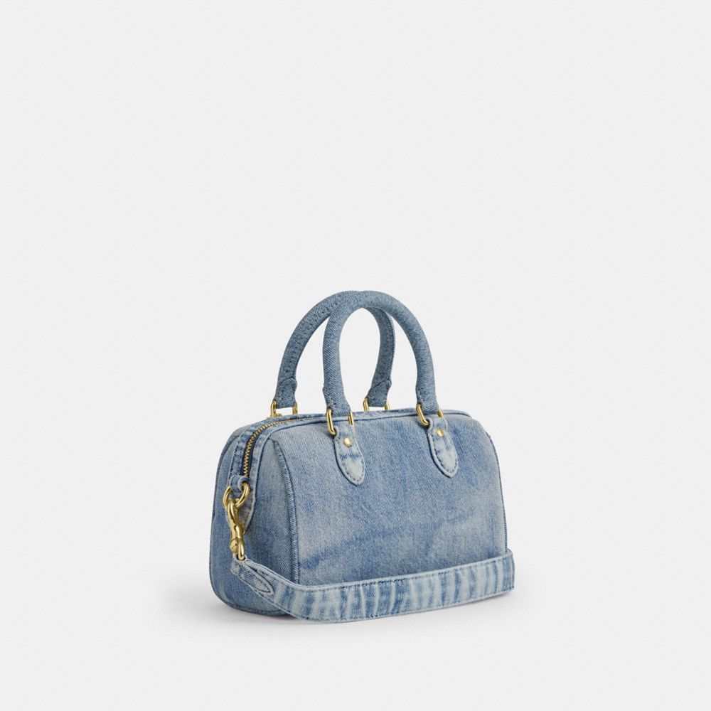 COACH®,Mini Rowan Crossbody Bag In Loved Denim With Charms,Denim,Recycled Polyester,Leather,Cotton,Barrel Bag,Logo,3D Embe...,Blue,Angle View