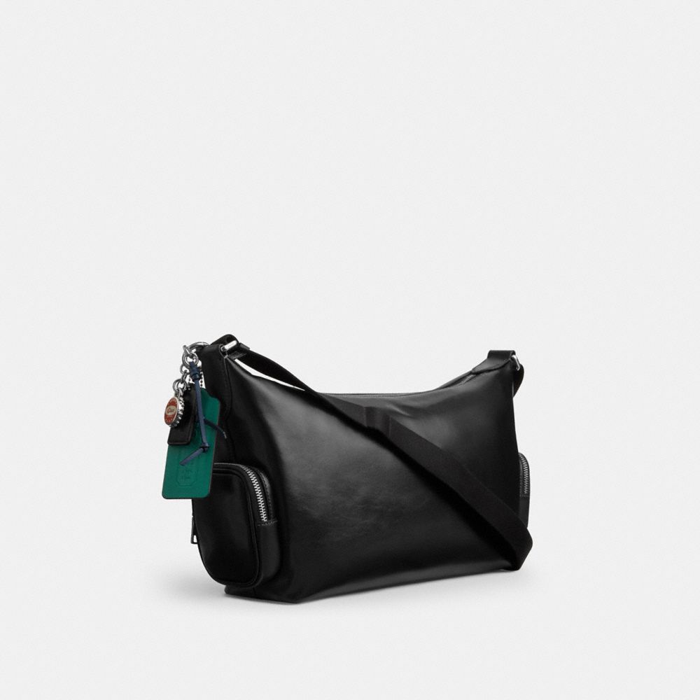 COACH®,Finn Crossbody Bag With Pockets And Charms,,Angle View