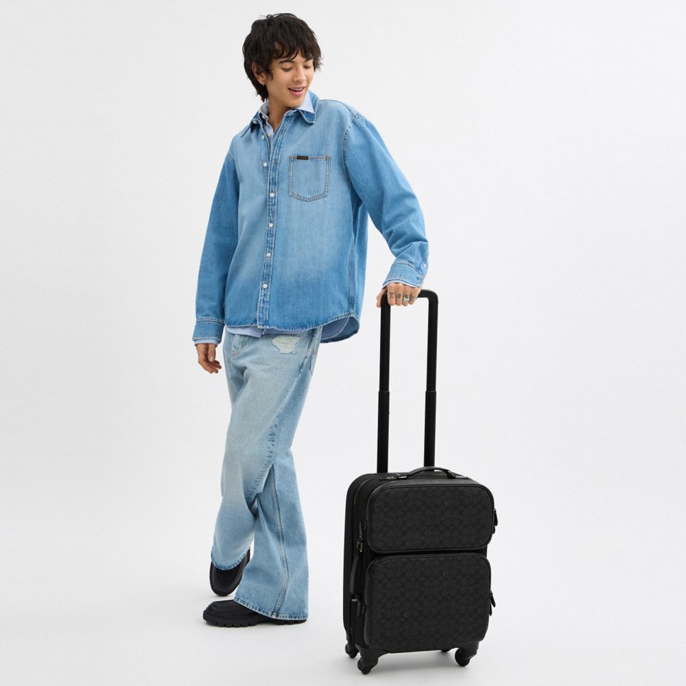 COACH®  Wheeled Carry On In Signature Canvas