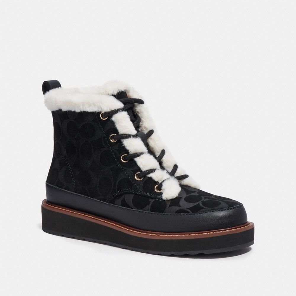What Goes Around Comes Around Chanel Black Suede Shearling