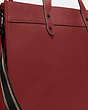 COACH®,FIELD TOTE 40 WITH COACH BADGE,Polished Pebble Leather,X-Large,Ruby Red,Angle View