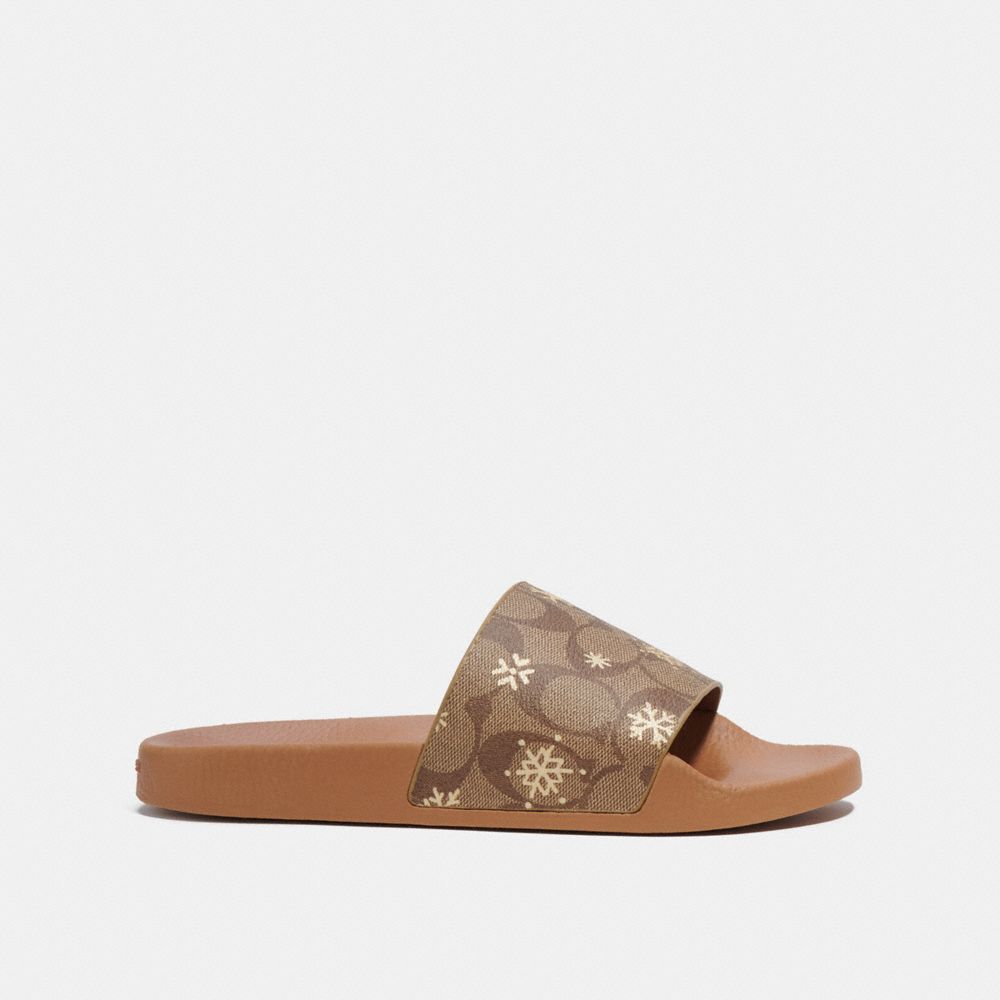 COACH®,ULI SPORT SLIDE IN SIGNATURE CANVAS WITH SNOWFLAKE PRINT,Light Saddle,Angle View