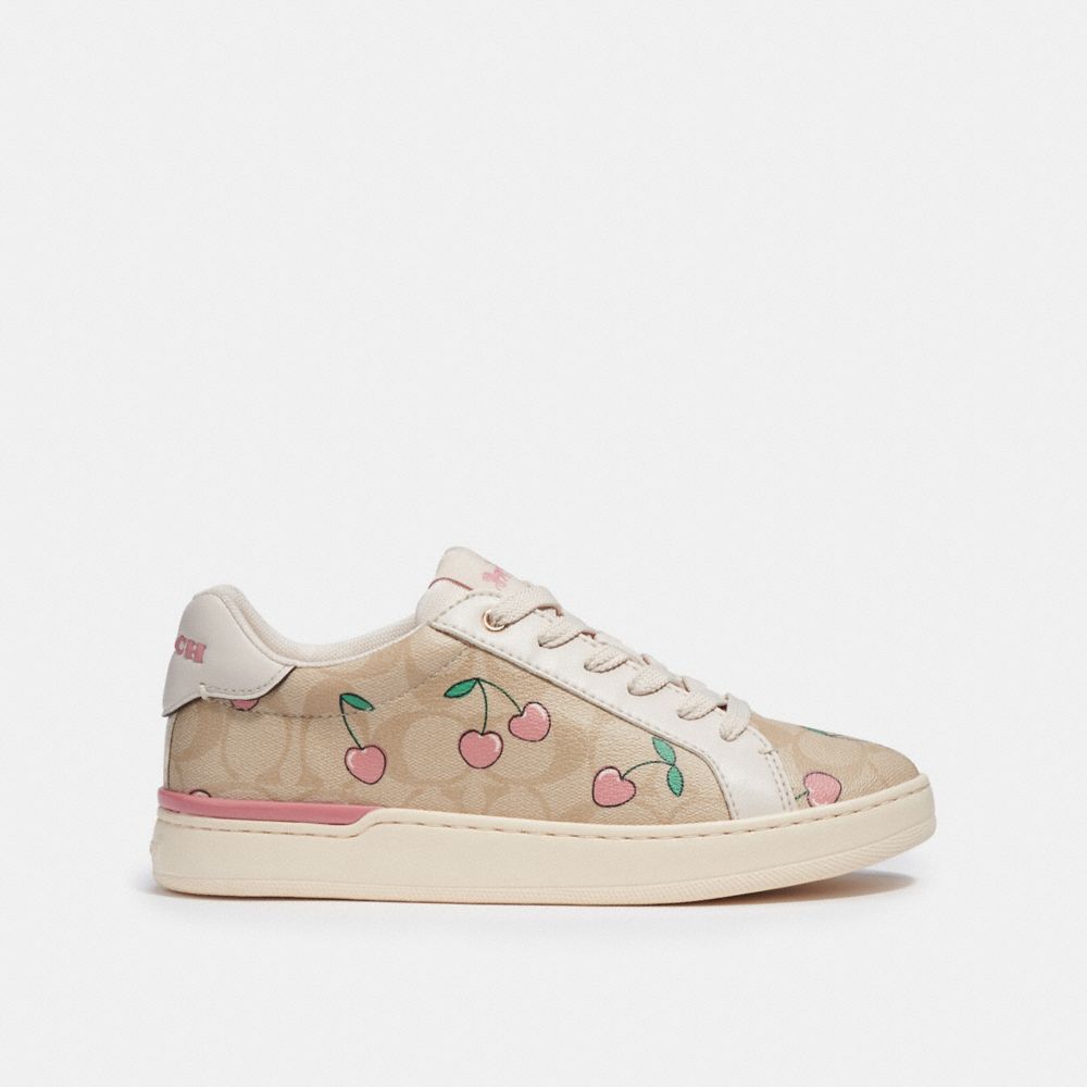 COACH®,CLIP LOW TOP SNEAKER IN SIGNATURE CANVAS WITH HEART CHERRY PRINT,pvc,Khaki/Pink,Angle View