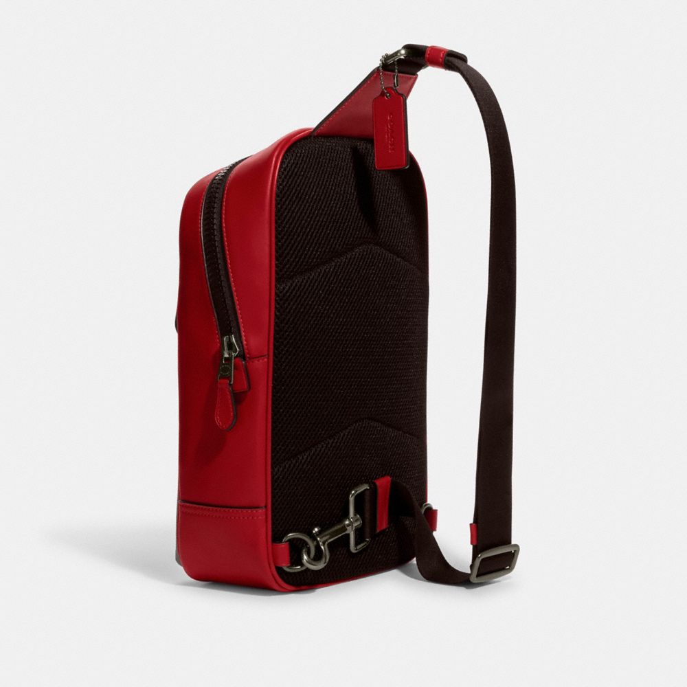 COACH®,WESTWAY PACK IN COLORBLOCK SIGNATURE CANVAS WITH COACH PATCH,Medium,Gunmetal/Mahogany/Bright Cardinal,Angle View