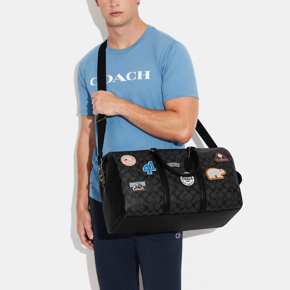 COACH®  Venturer Bag In Signature Canvas With Ski Patches