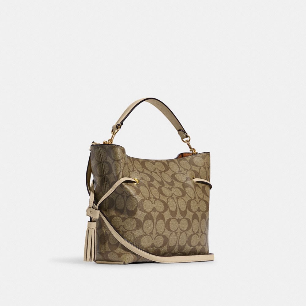 COACH®,ANDY CROSSBODY IN SIGNATURE CANVAS,Medium,Im/Khaki/Ivory,Angle View